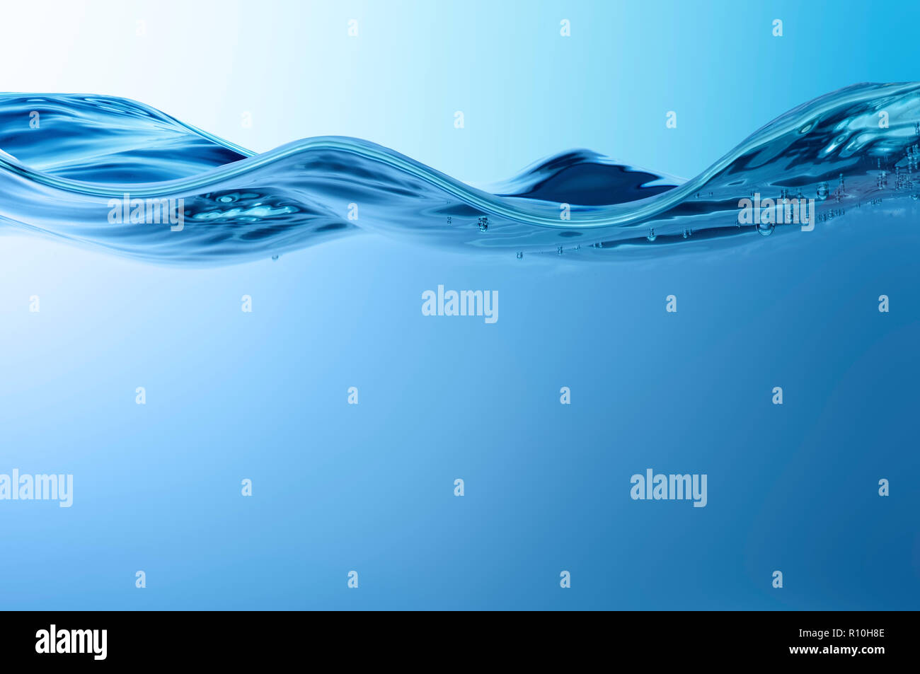 Close up side view of disturbance on surface of water, small bubbles Stock Photo