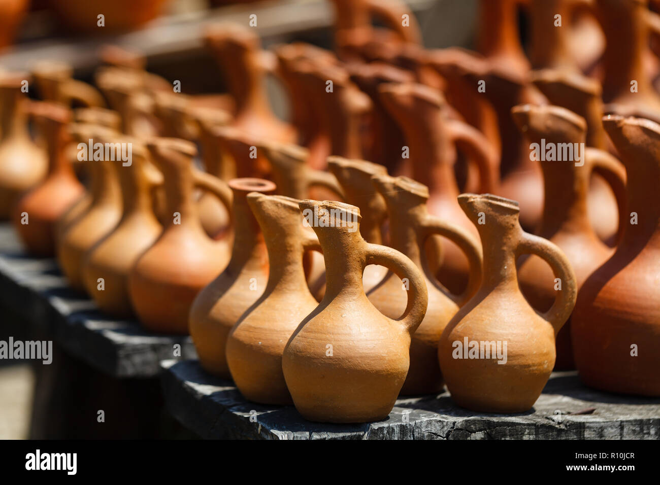 Traditional clay jugs for sale in the village Stock Photo Alamy