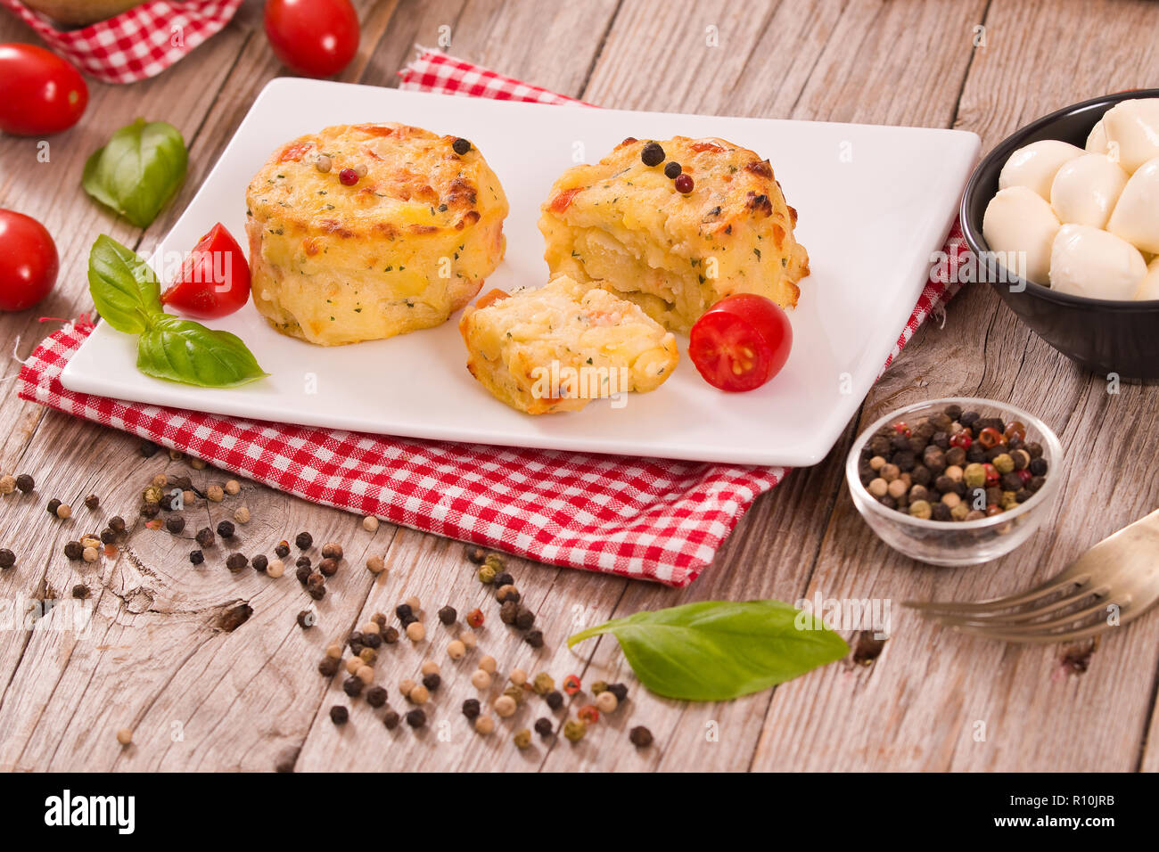 Potato gratins with mozzarella and tomatoes Stock Photo Alamy