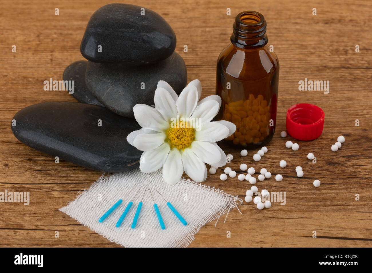 Acupuncture and Homeopathy medicine on wooden background Stock Photo ...