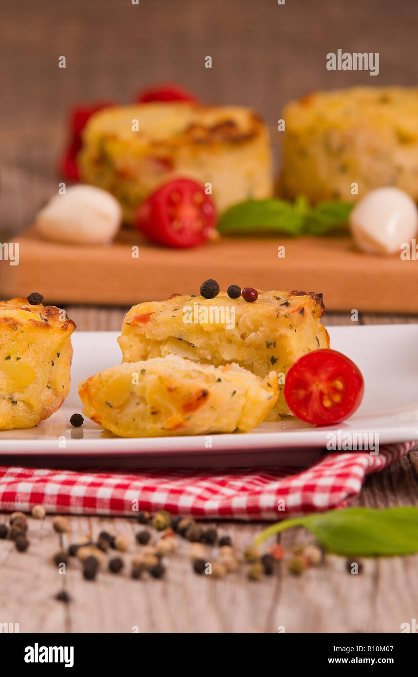Potato gratins with mozzarella and tomatoes Stock Photo Alamy