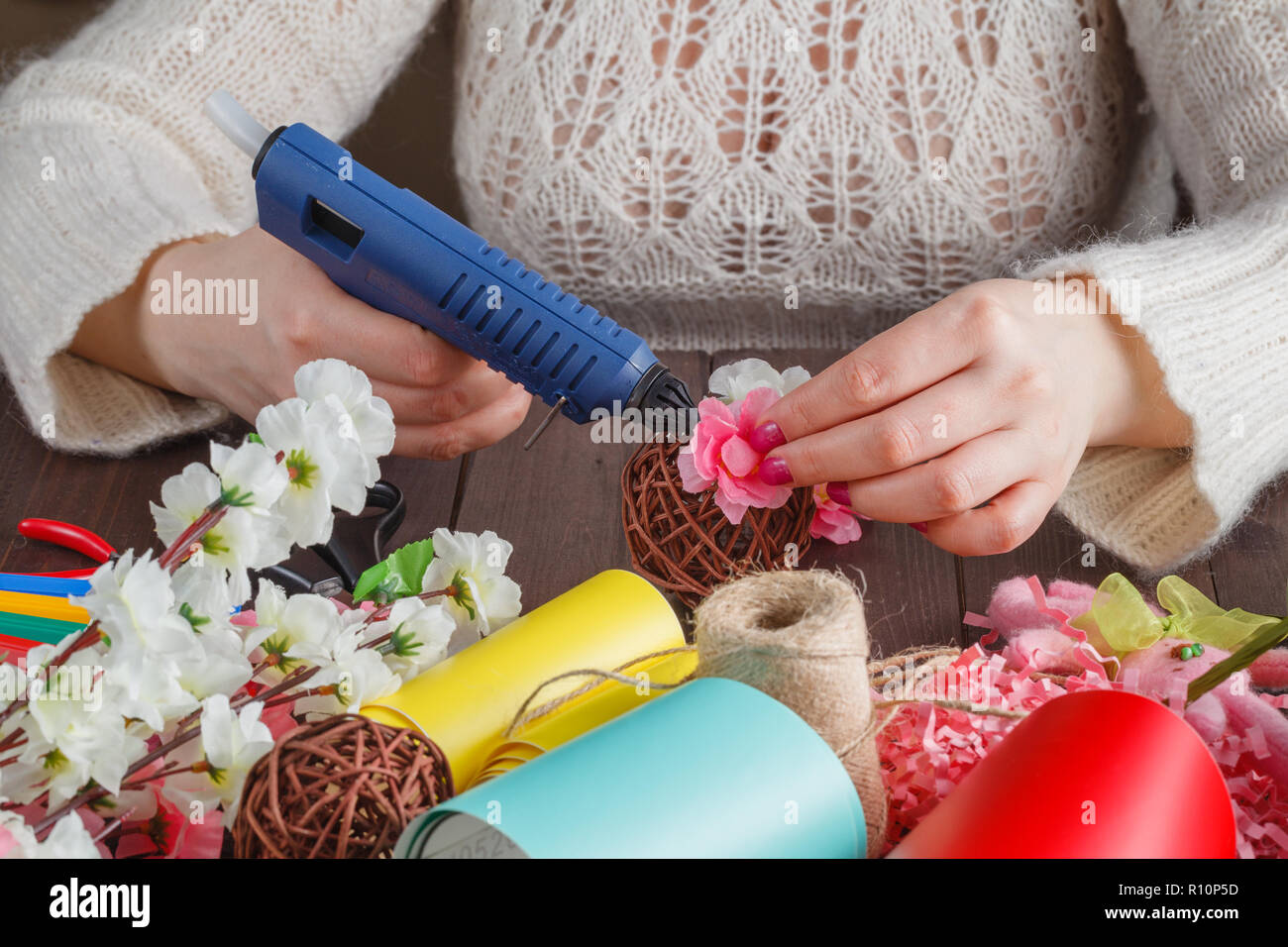 Woman make floral decor with melt glue gun Stock Photo Alamy