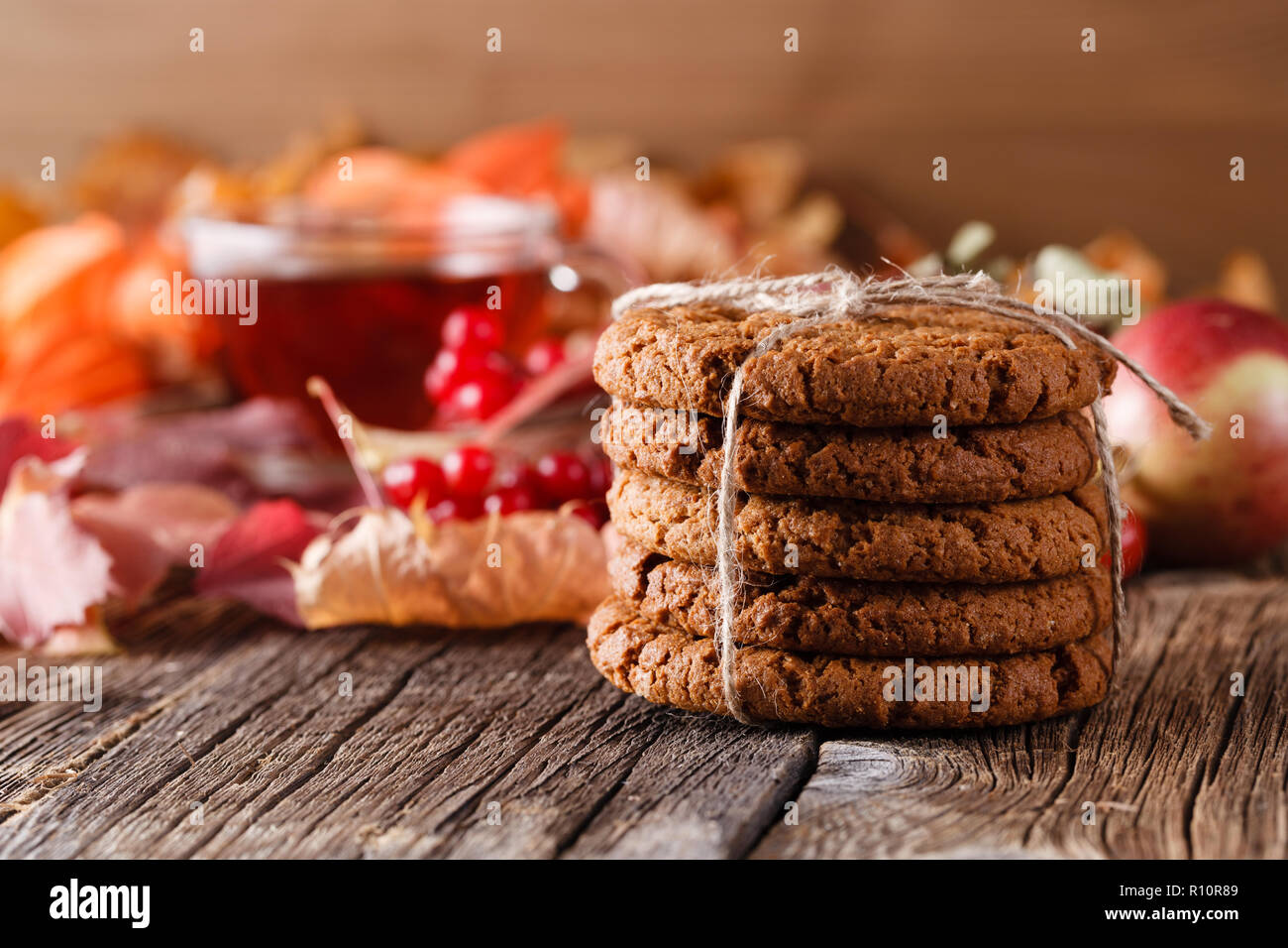 Fall wealth on rustic wooden background with oat cookies Stock Photo ...