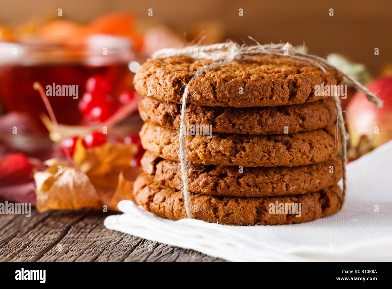 Fall wealth on rustic wooden background with oat cookies Stock Photo ...