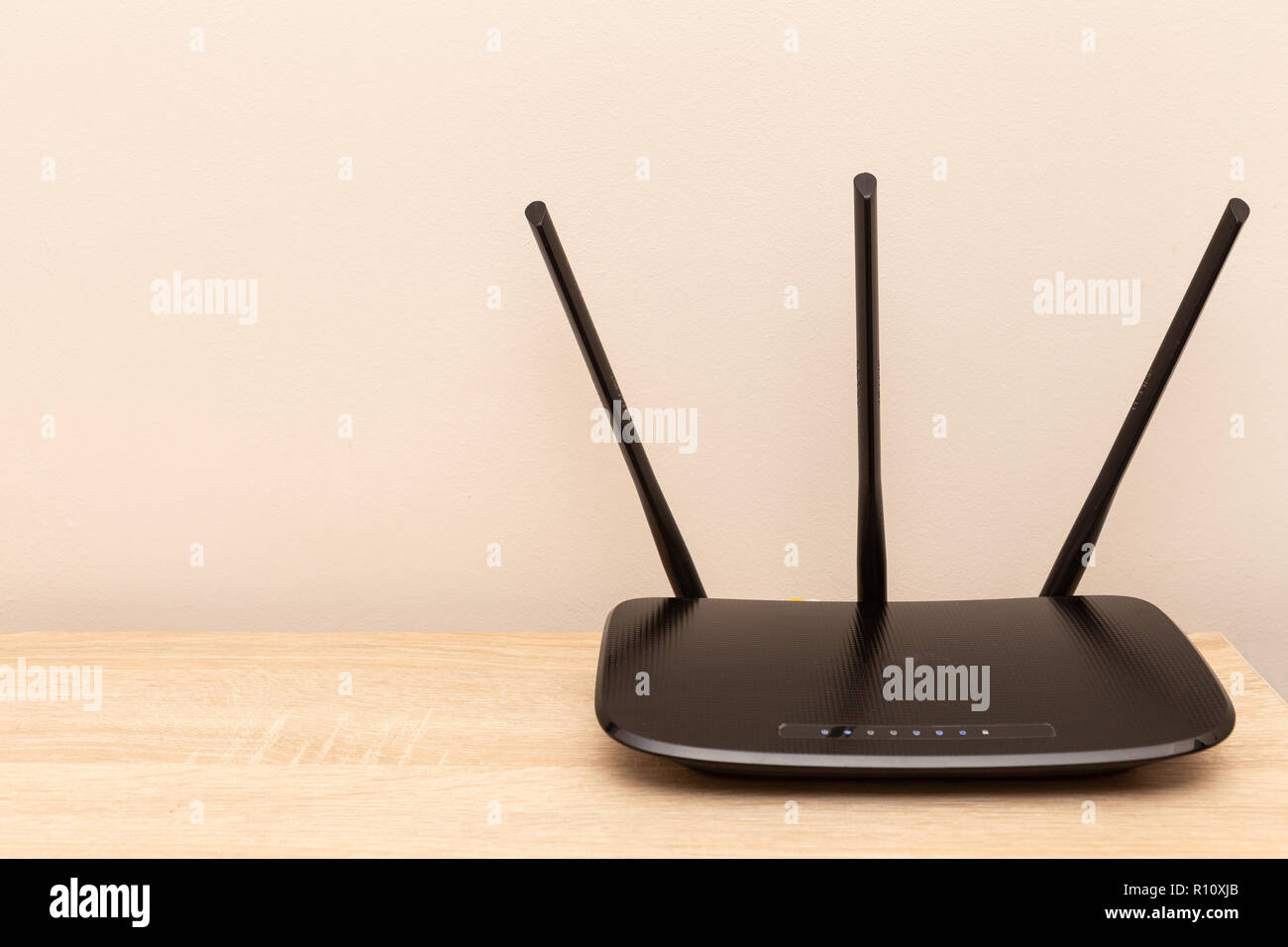 Black router on top of furniture as home or wifi concept