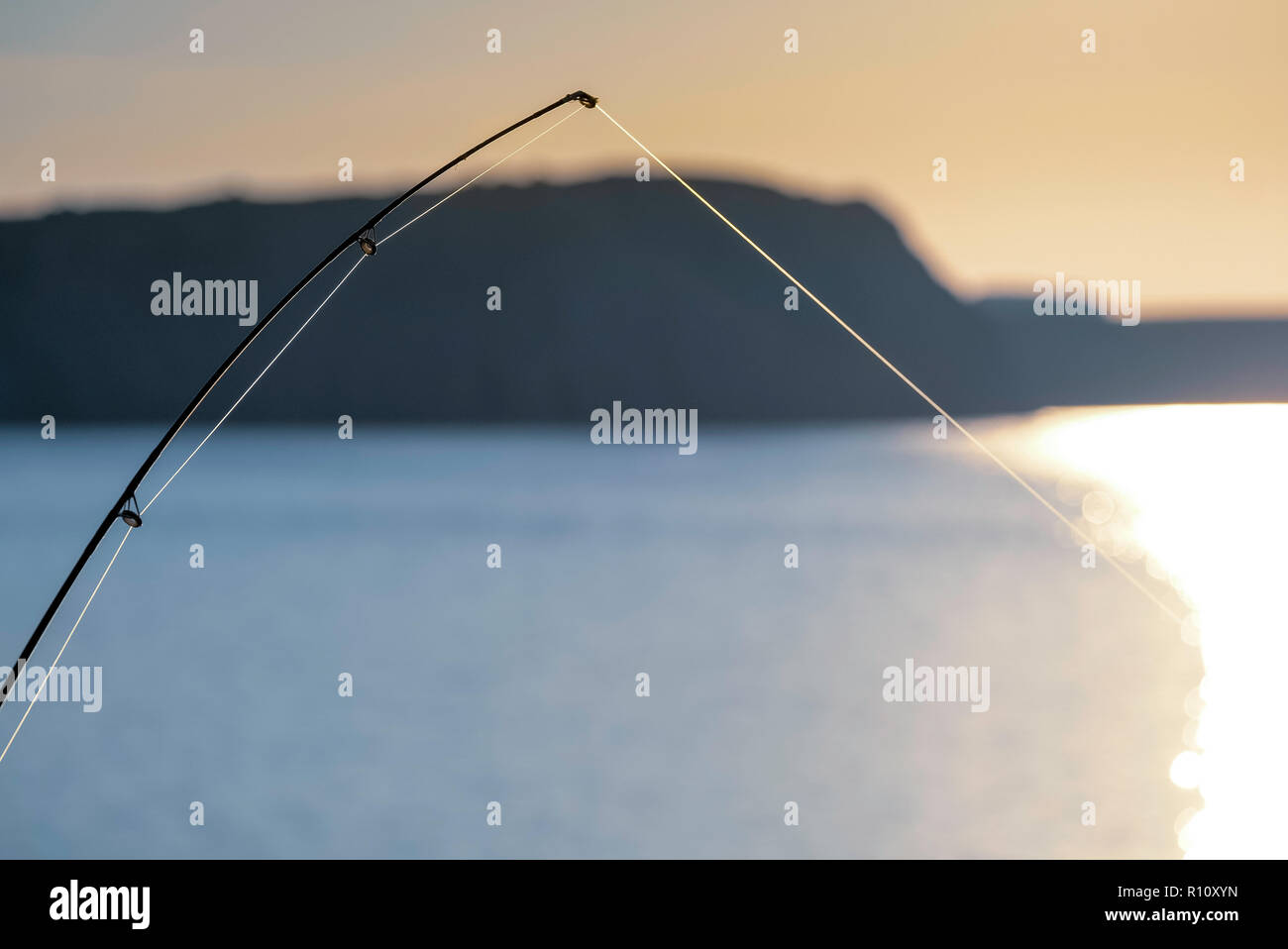 BENT  SEA FISHING ROD AND TIGHT LINE Stock Photo