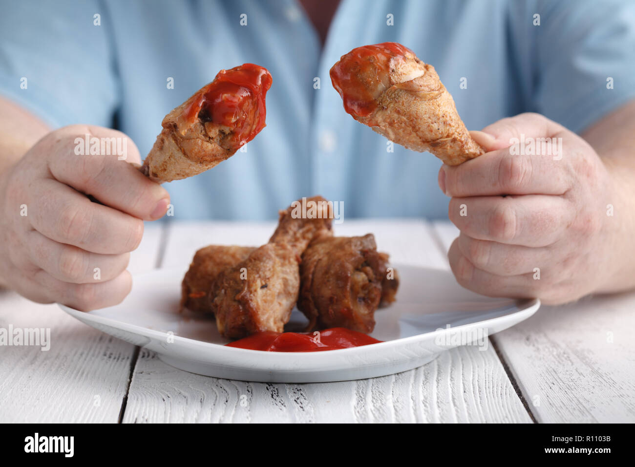 Eat unhealthy fry chicken leg with ketchup Stock Photo Alamy