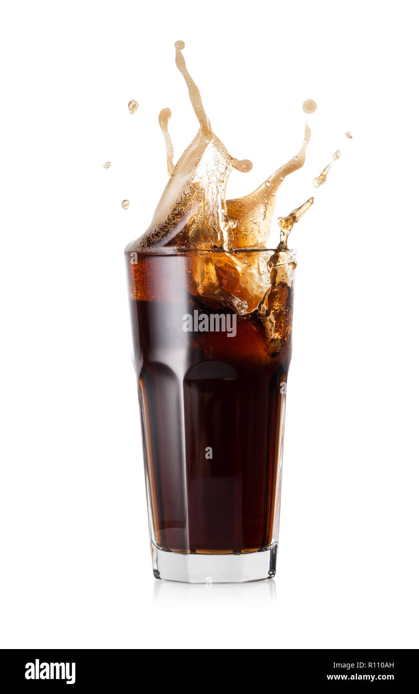 A glass of cold cola with a splash of ice cubes. Isolated on white ...