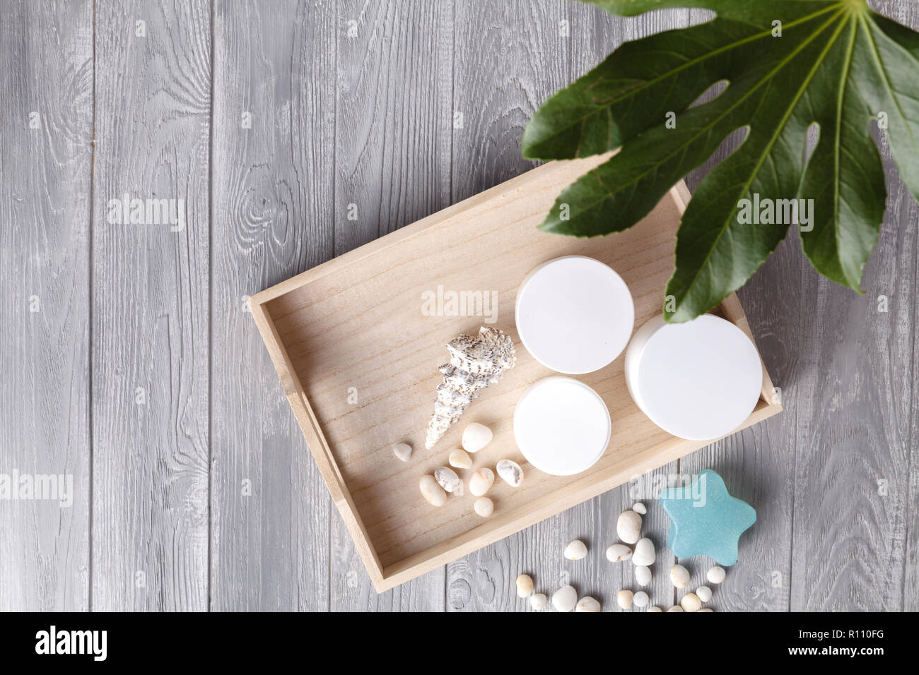 Various spa related objects on gray background, top view. Body and skin care Stock Photo