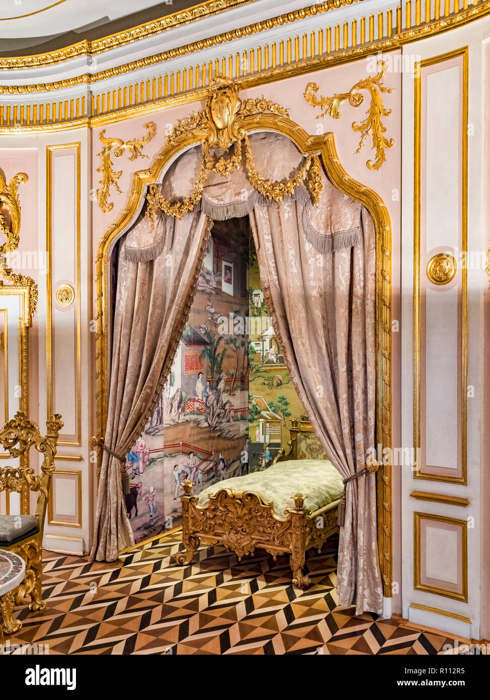 18 September 2018: St Petersburg, Russia - Bed in the State Bedroom or Crown Room in Peterhof Grand Palace. Stock Photo