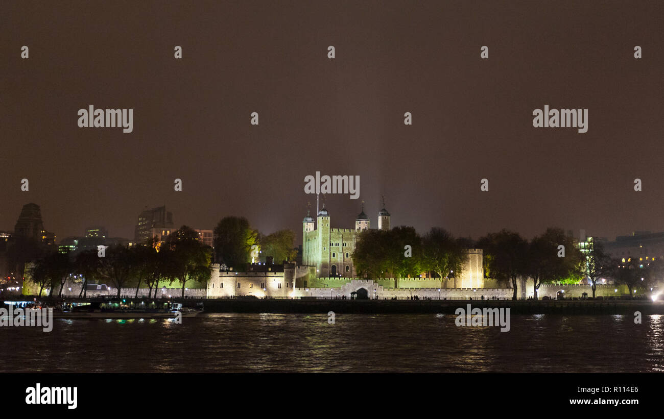 A view of the Tower of London across the River Thames at night, London, England Stock Photo