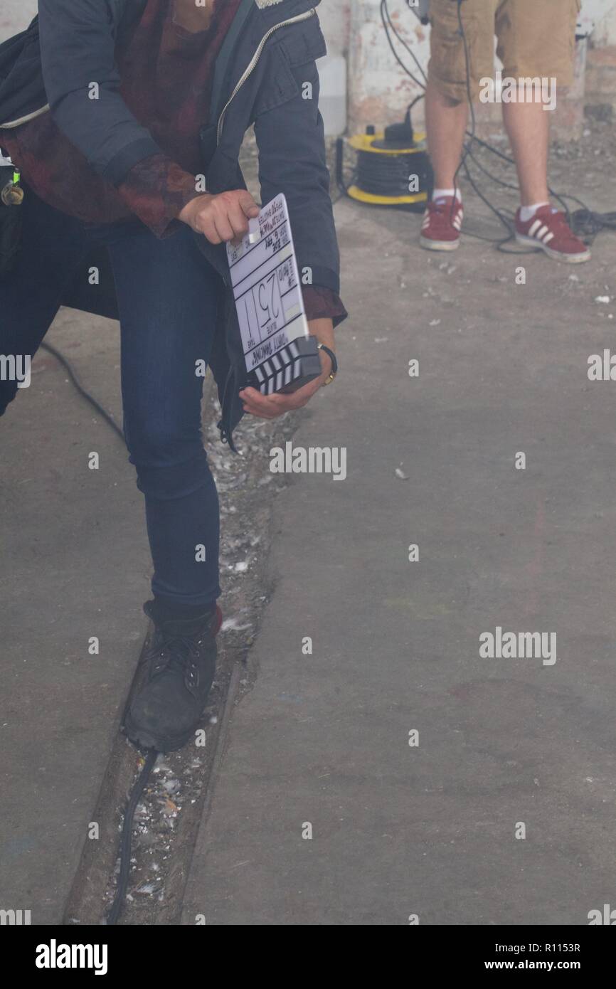 woman holding clapperboard Stock Photo