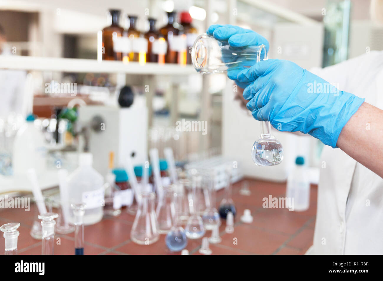 A scientist in laboratory analyzing water sample Stock Photo