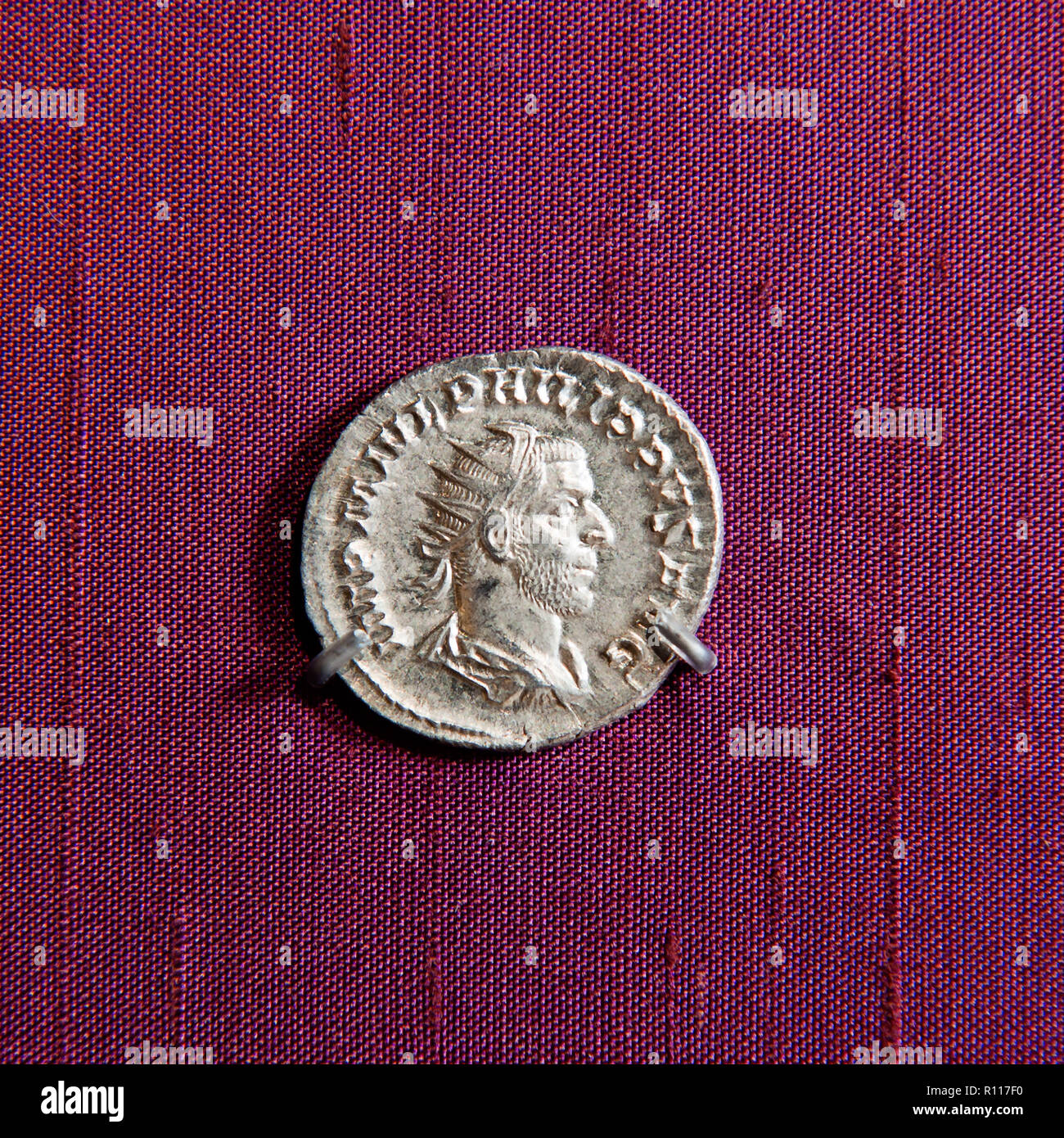 Man's profile on ancient coin Stock Photo