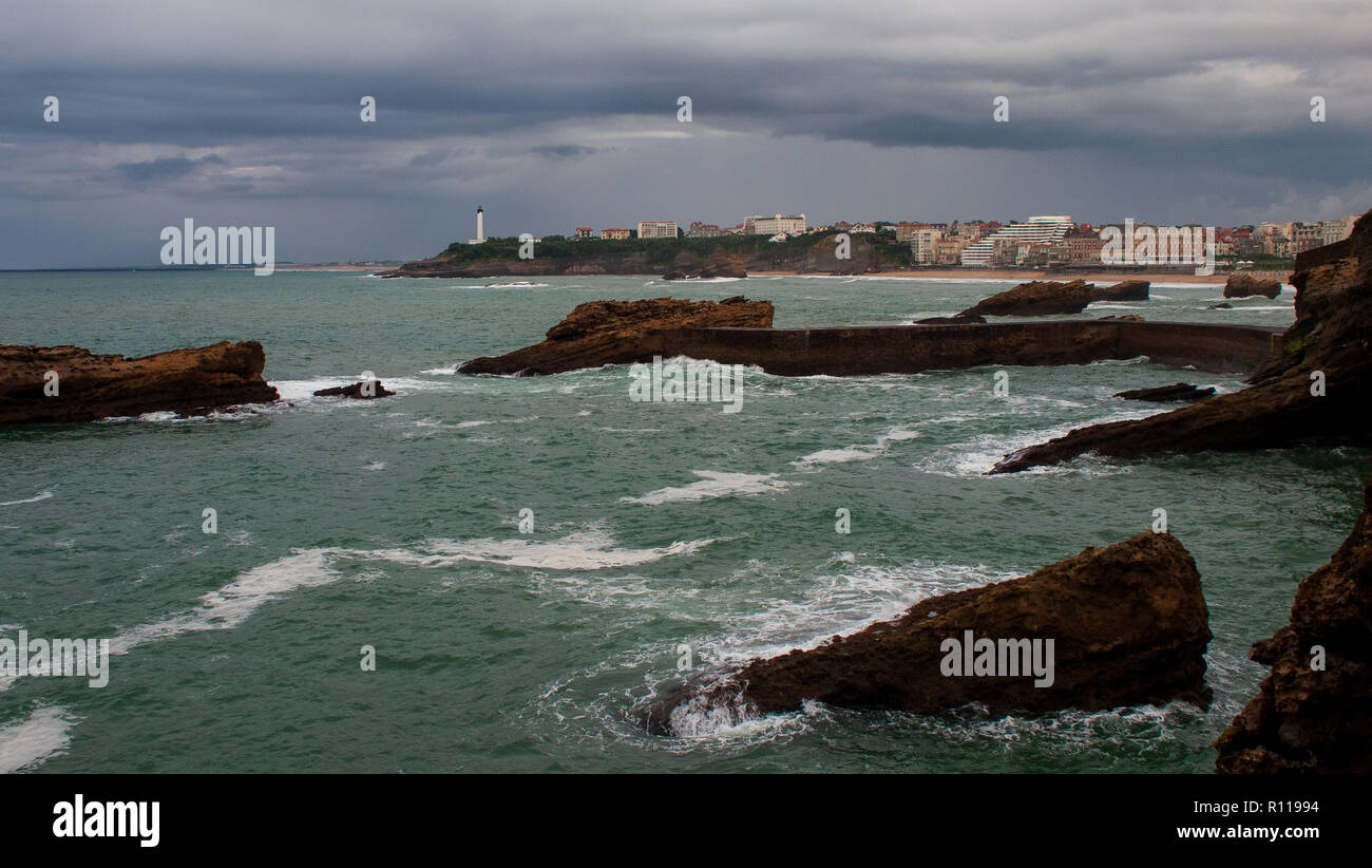 Stormy weather over Biarritz, France. The lighthouse in the background ...