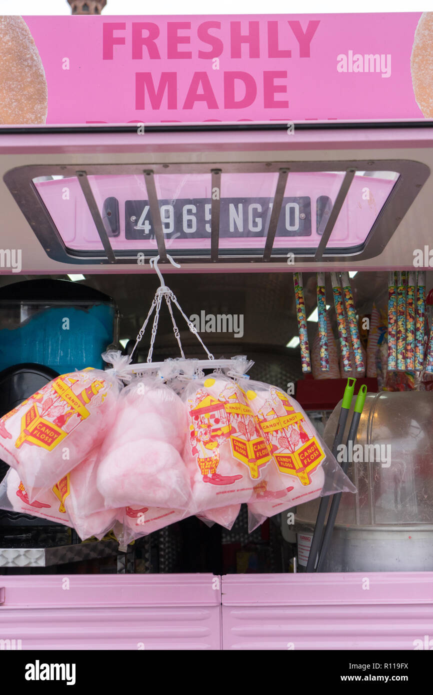 A street vendor selling candy floss and popcorn from a converted pink van at the Albert Dock in Liverpool Stock Photo