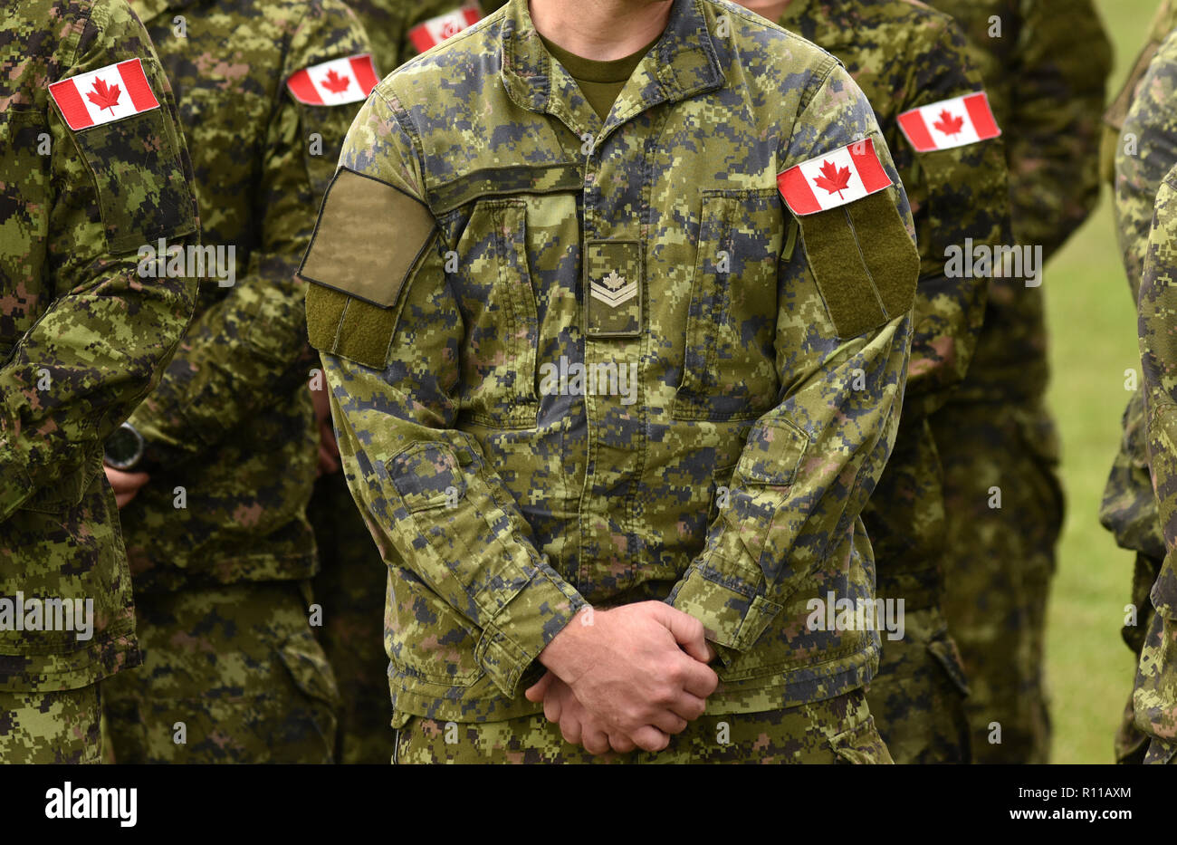 Canadian troops. Canadian Army. Canada flags on soldiers arm. Stock Photo
