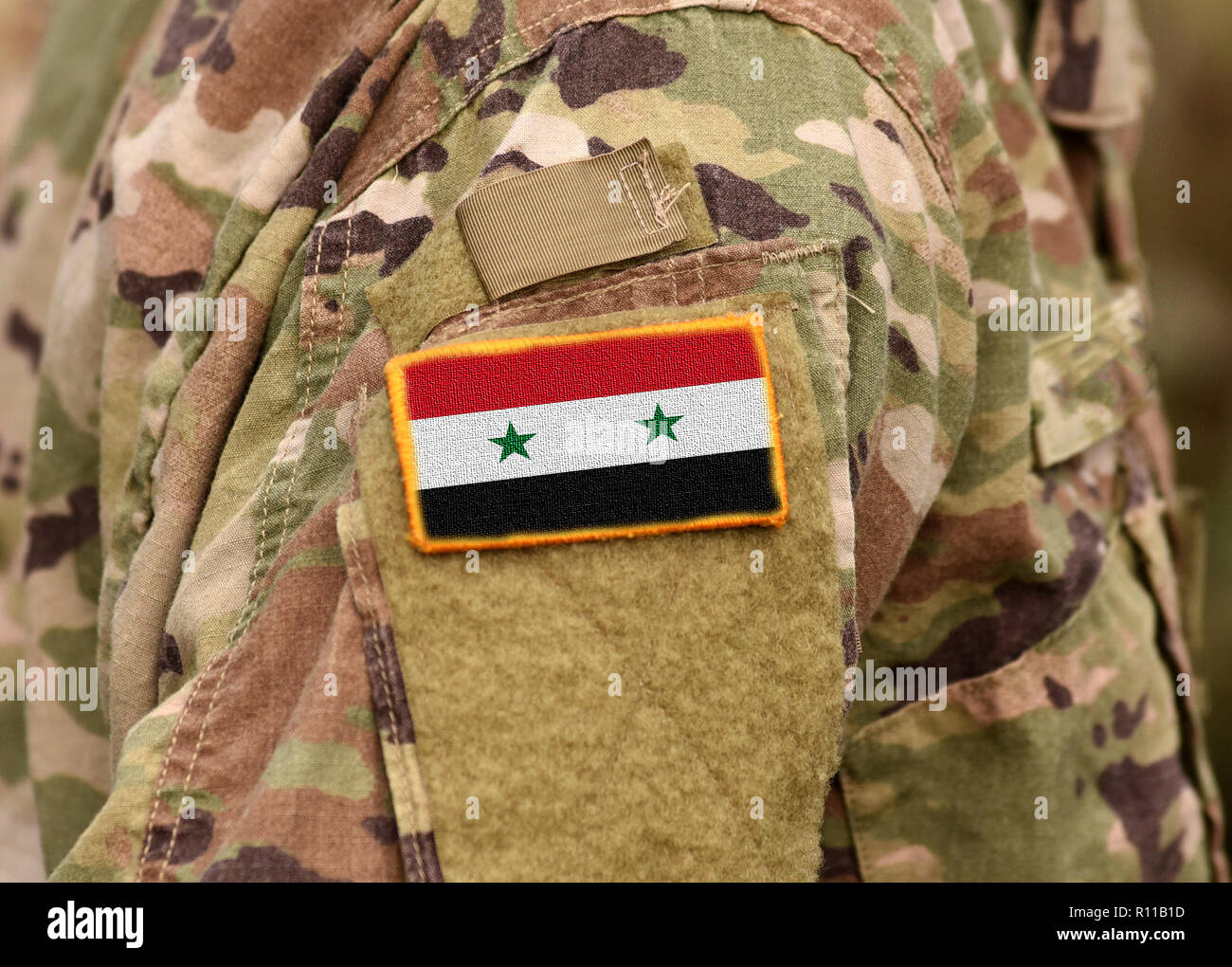 Syrian flag on soldiers arm. Syria army. Syrian troops. Stock Photo