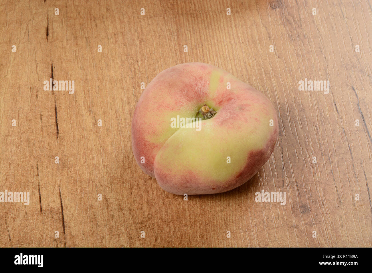 Some donut peaches on brown background Stock Photo