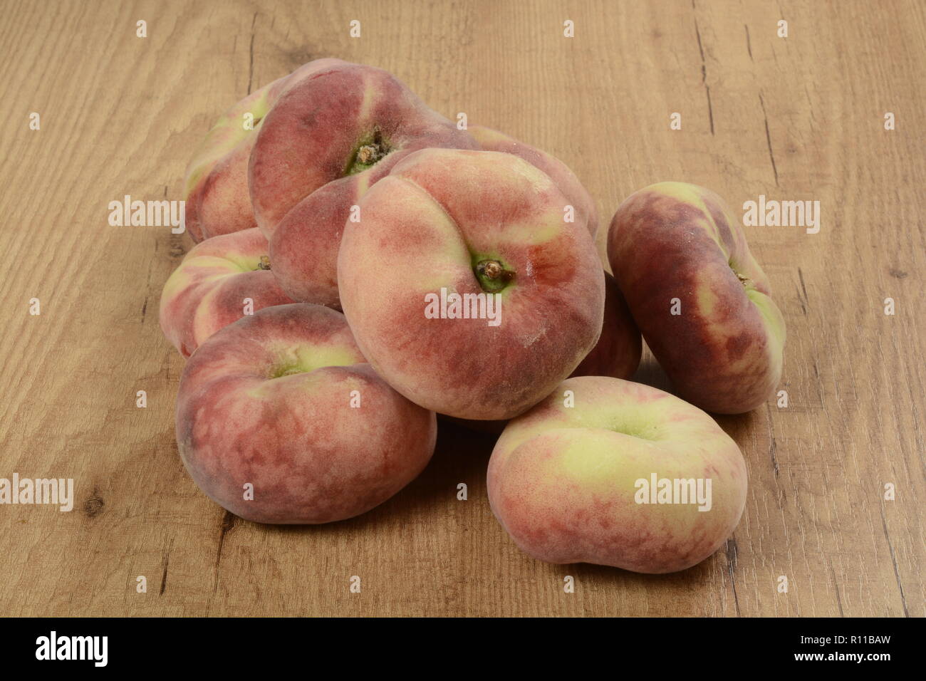 Some donut peaches on brown background Stock Photo