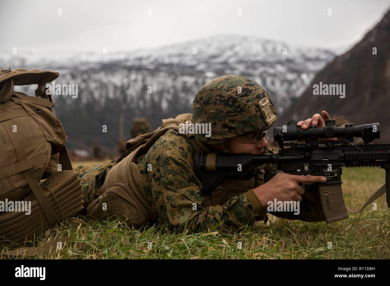 A U.S. Marine Corps holds a position during Exercise Trident Juncture 18 October 31, 2018 in Gjora, Norway. The multi-national exercise is the largest NATO exercise since 2015, and includes more than 50,000 military members from 31 countries. Stock Photo