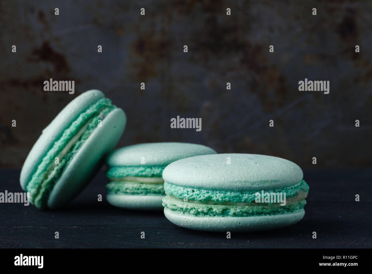 Blue french macaroons on rustic background Stock Photo