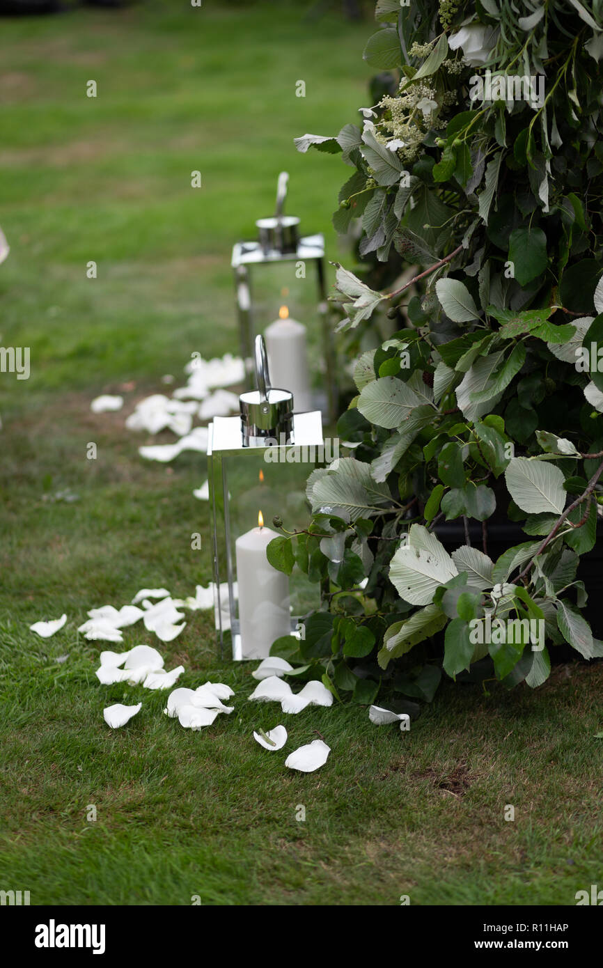 Candle lanterns lining the aisle at a wedding Stock Photo Alamy