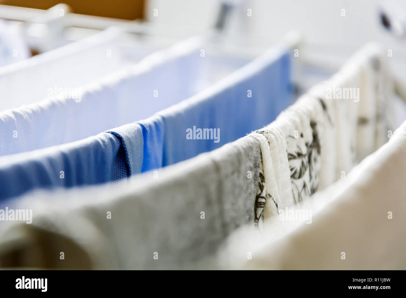 Wet clothes indoors hi-res stock photography and images - Alamy