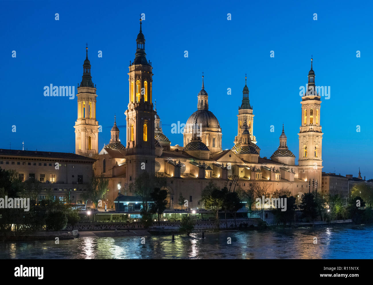 Zaragoza, Spain. View of the Basilica de Nuestra Senora del Pilar (Basilica of Our Lady of the Pillar) and the River Ebro at night, Zaragoza, Spain Stock Photo
