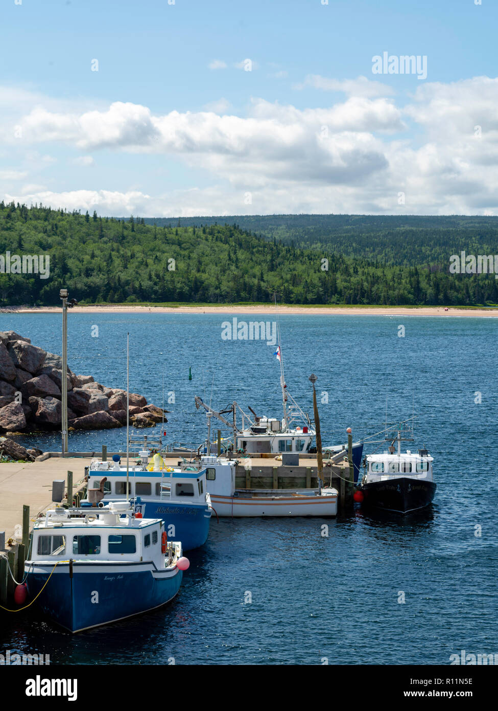 Lobster boats at the dock in Neils Harbour, Nova Scotia, Canada Stock