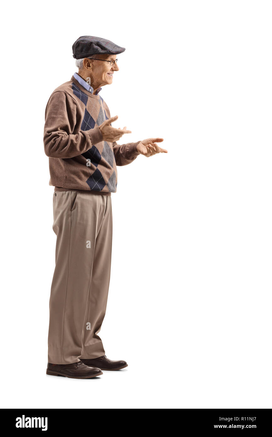 Full length shot of a senior man standing alone and gesticulating conversation isolated on white background Stock Photo