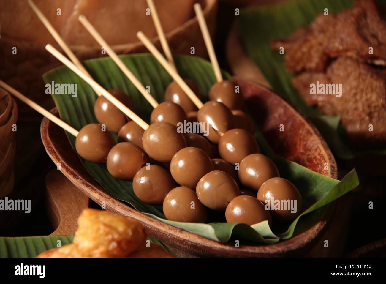 Sate Telur Puyuh. Satays of quail eggs braised in soy sauce. Stock Photo