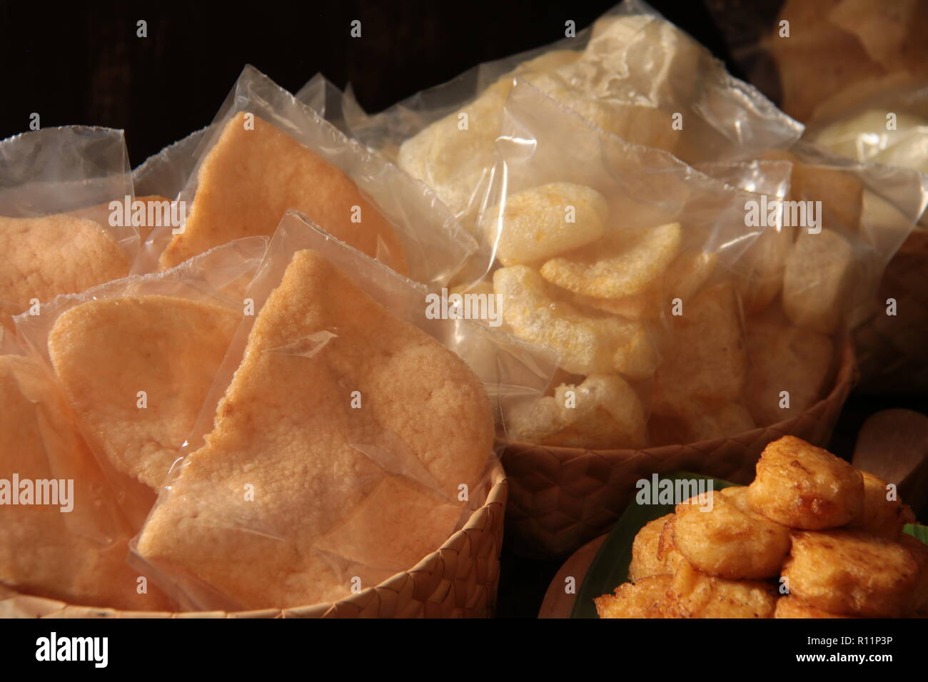 Kerupuk Udang and Kerupuk Rambak. Indonesian prawn crackers and cow skin crackers as side dishes for Nasi Pindang Kudus. Stock Photo