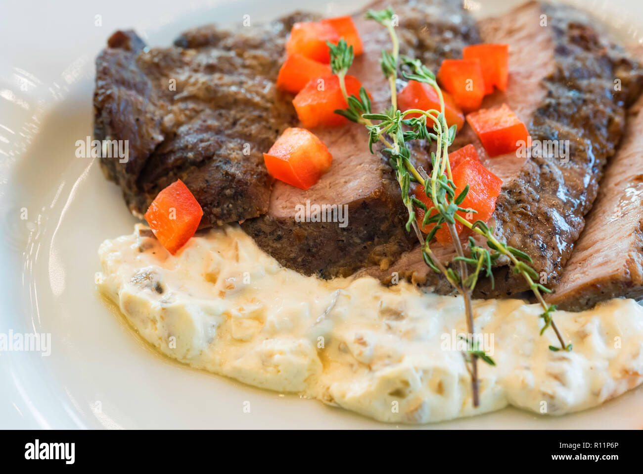 Beef fillet tagliata with vegetables on plate close Stock Photo Alamy