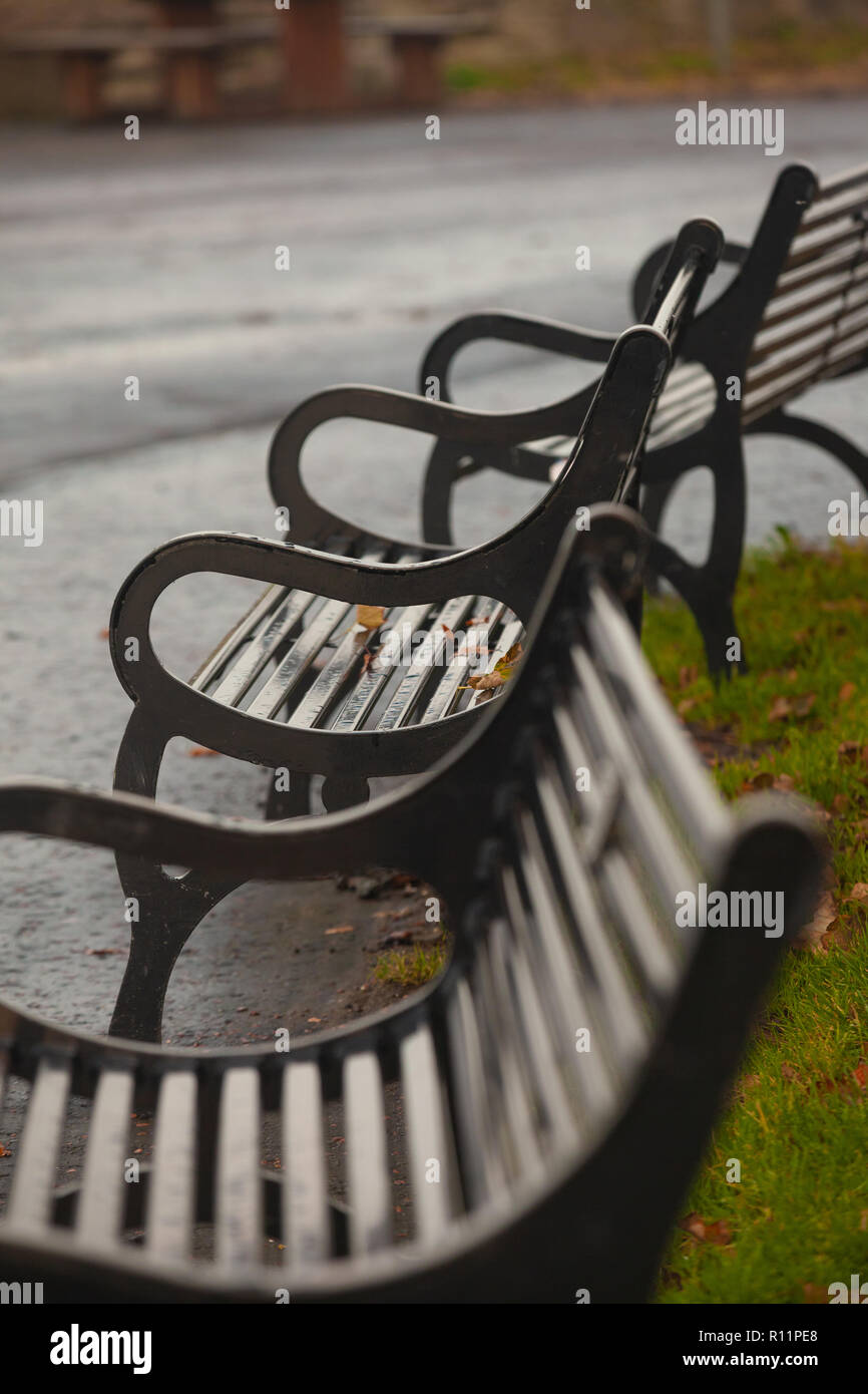 Metal Park benches in a row in Cramond Edinburgh Scotland Stock Photo