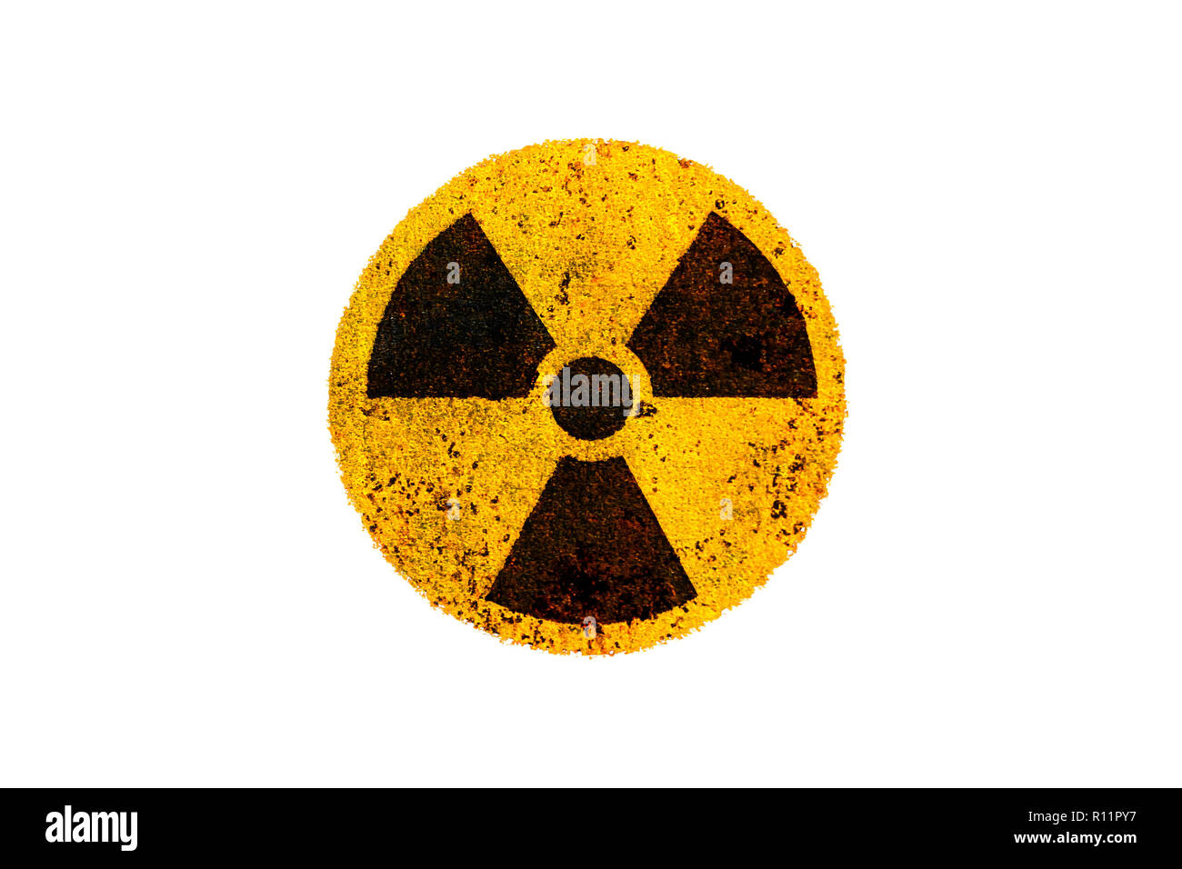 Round yellow and black radioactive (ionizing radiation) nuclear danger symbol on rusty metal grungy texture and isolated on white background. Stock Photo