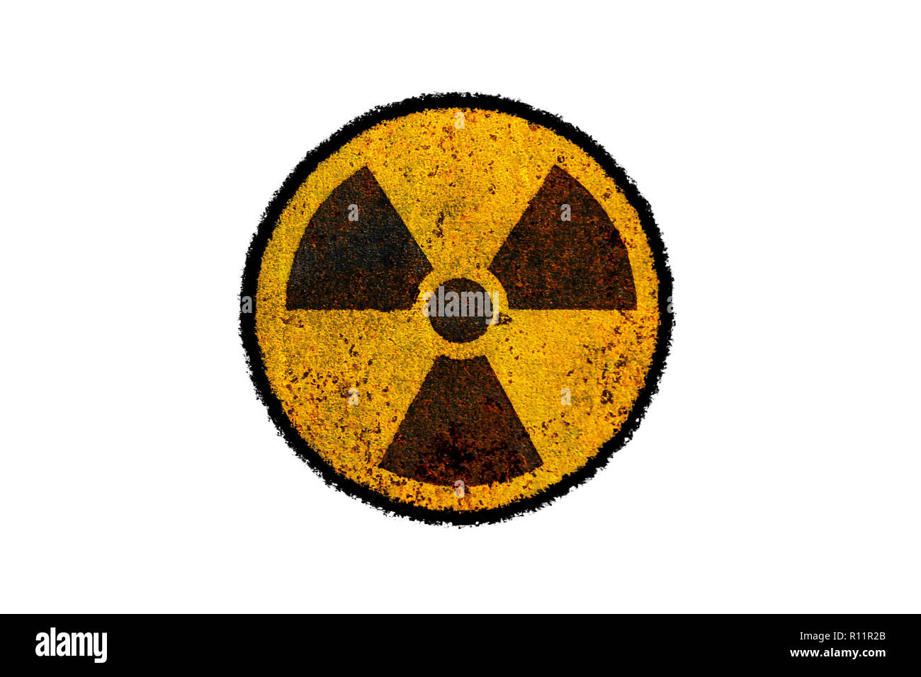 Round yellow and black radioactive (ionizing radiation) nuclear danger symbol on rusty metal grungy texture and isolated on white background with surr Stock Photo
