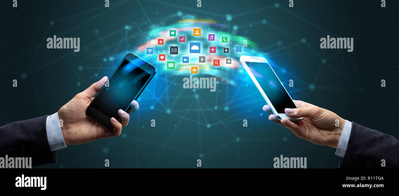 Two Apps Syncing Two mobile phones syncing applications concept Stock Photo - Alamy