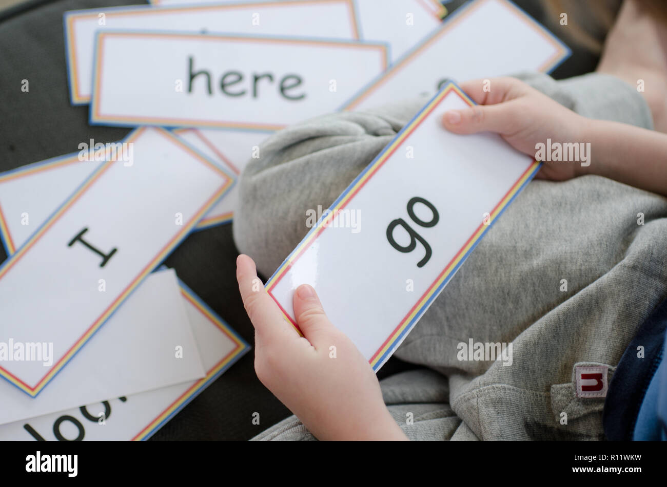 Learning to read with flash cards Stock Photo