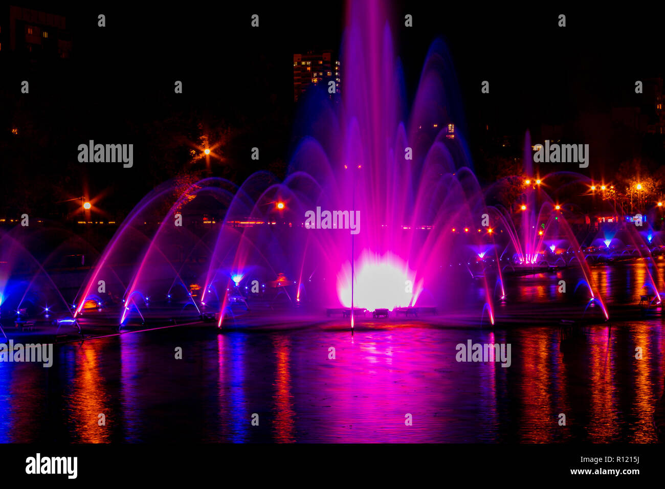 Glowing multicolored illumination fountains in the Far Eastern city of Khabarovsk. Stock Photo