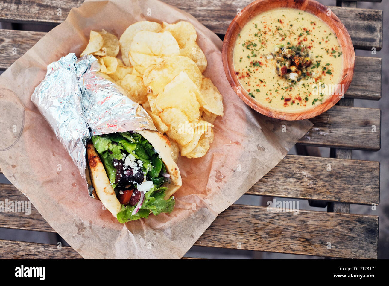 Meal of salad wrap, potato chips and dip Stock Photo