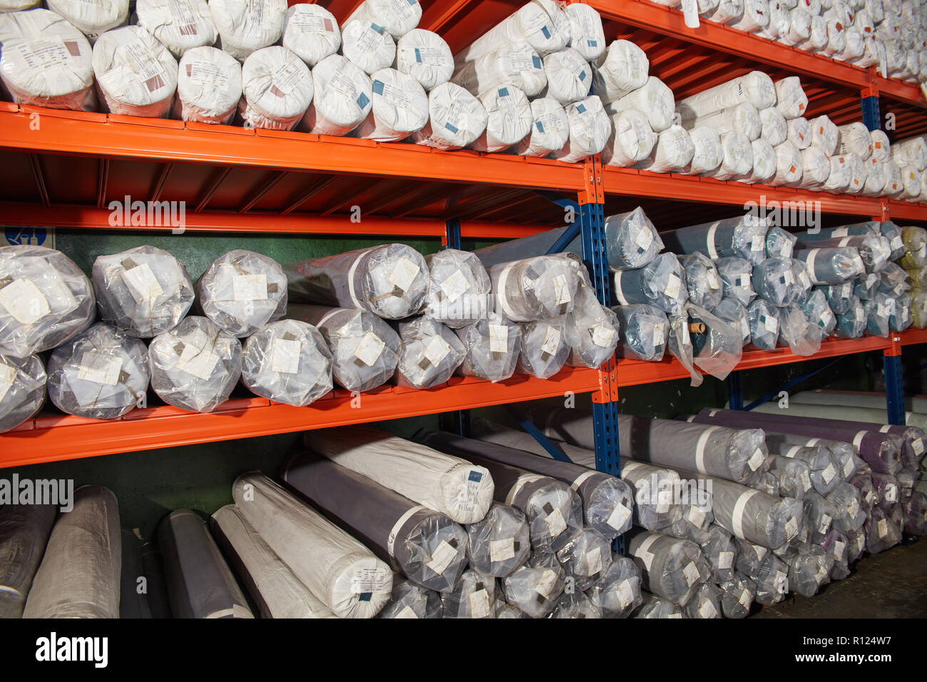 Shelf in a carpet warehouse in a warehouse in a mail order Stock Photo -  Alamy