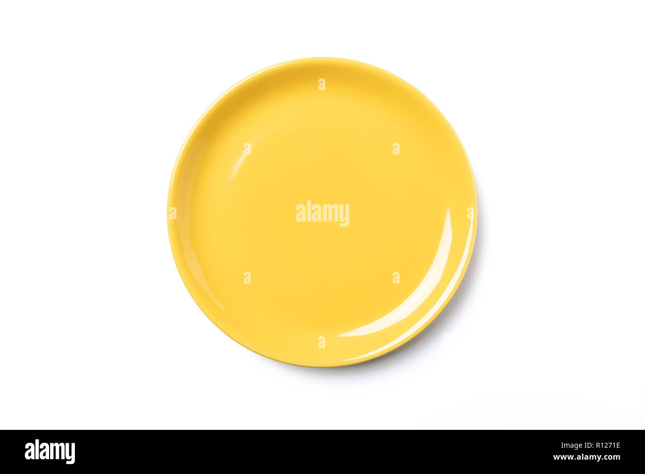 Pastel yellow plate isolated on white background, view directla from above, clipping pass