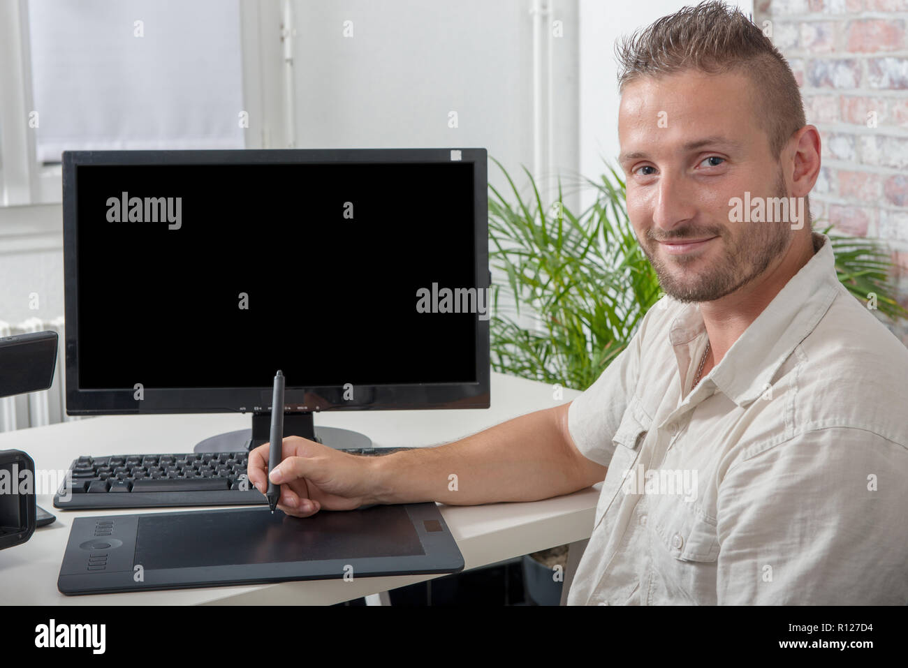 man video editor using a graphic tablet Stock Photo