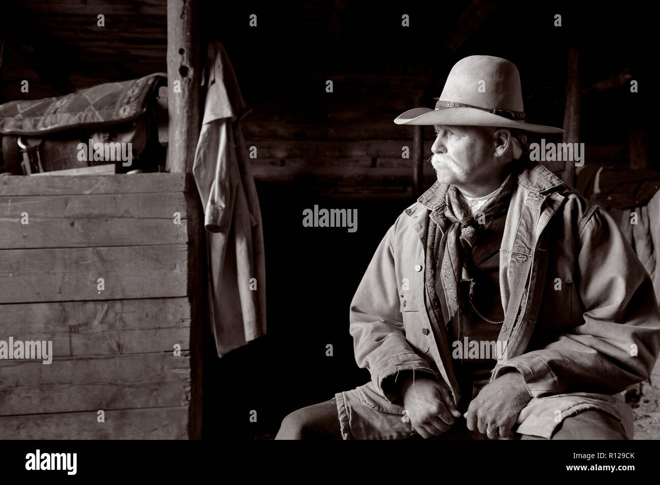 WY02428-01....WYOMING - Mike Buckich in the barn at the Willow Creek Ranch. MR# B18 Stock Photo