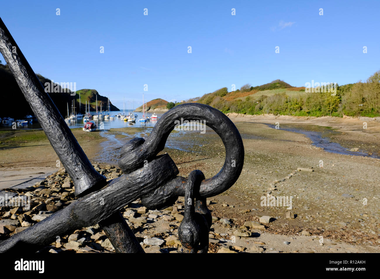 Watermouth Cove and harbour inlet at low tide showing beached yachts