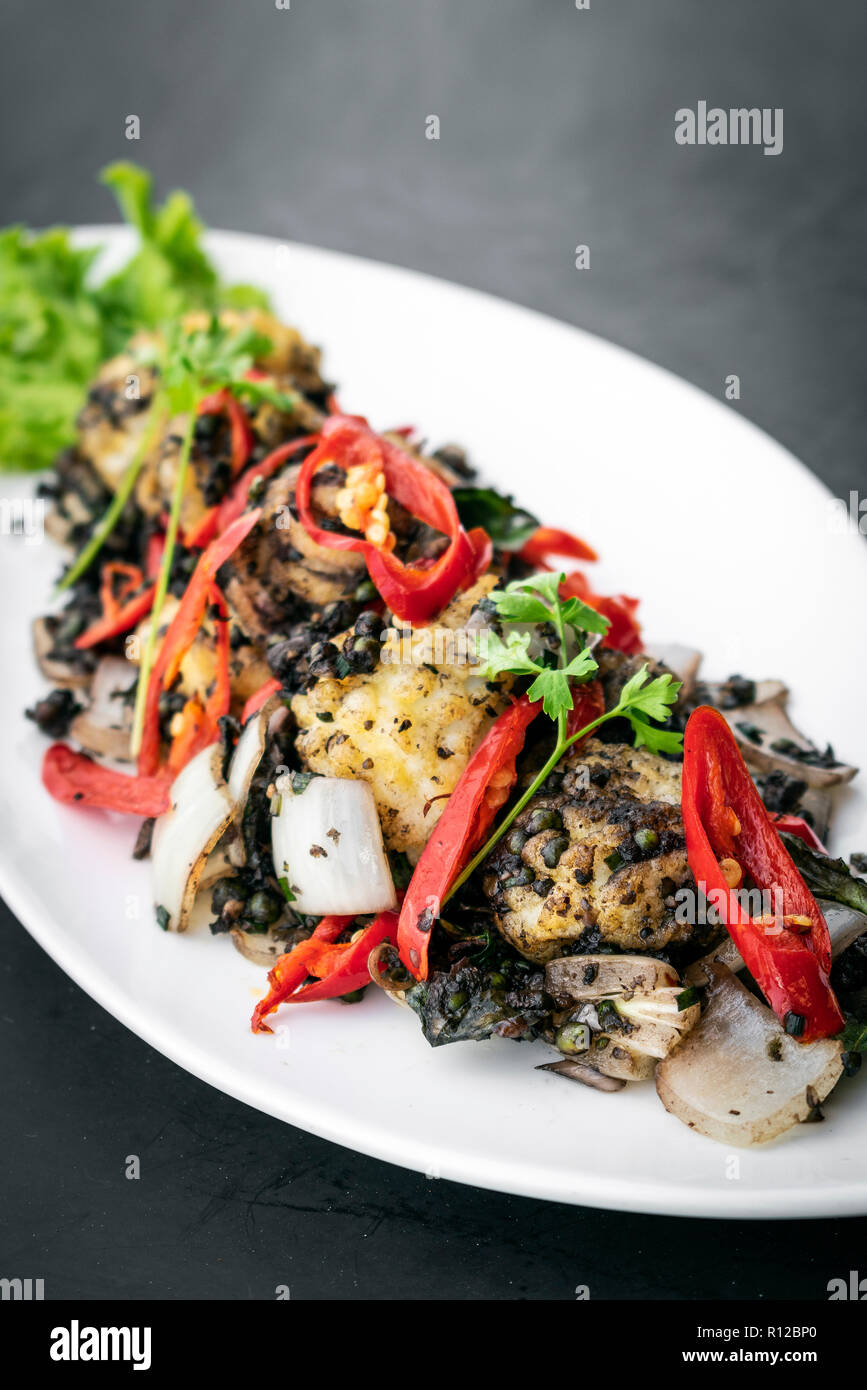 stir fry fresh spicy squid with kampot pepper famous khmer dish in