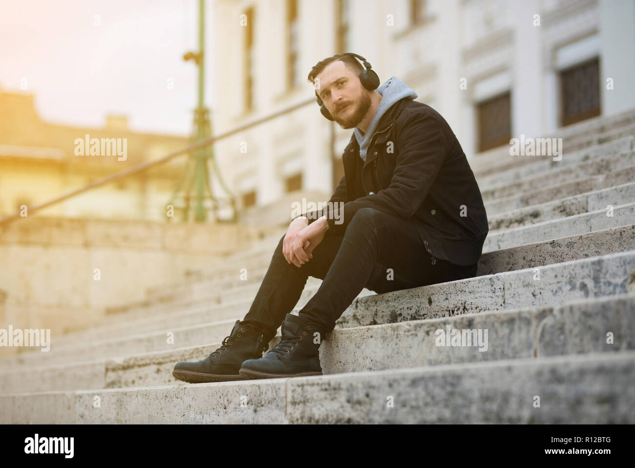 Man sitting alone on stairs hi-res stock photography and images - Alamy