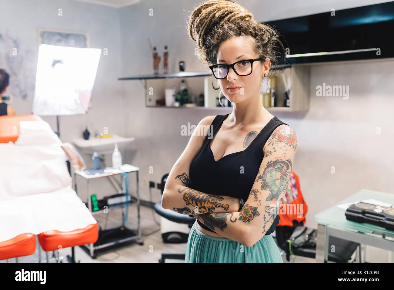 Tattooist in parlour Stock Photo