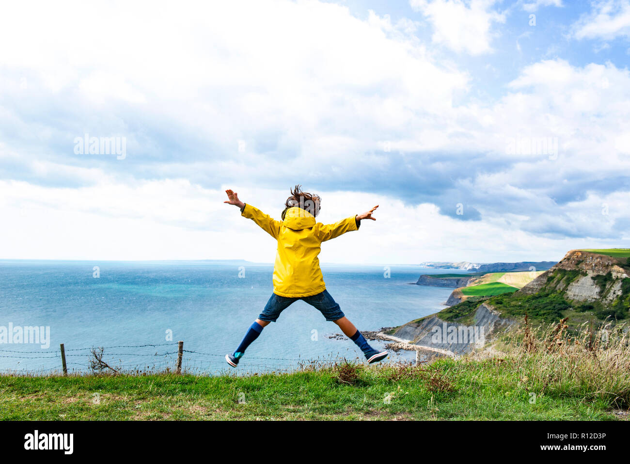 Boy jumping cliff hires stock photography and images Alamy